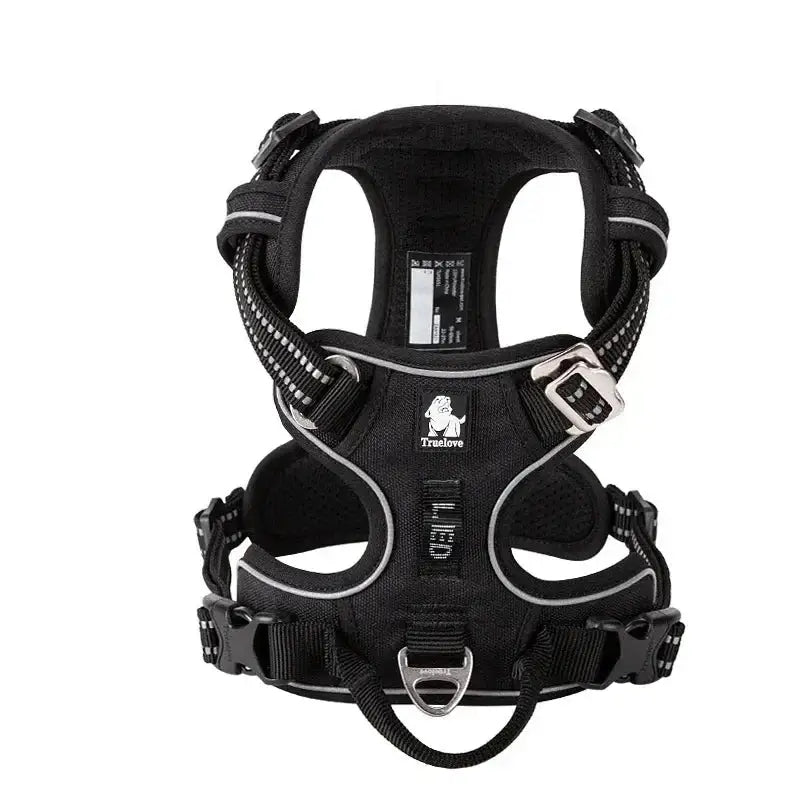 Black dog harness with reflective trim and multiple adjustment straps.