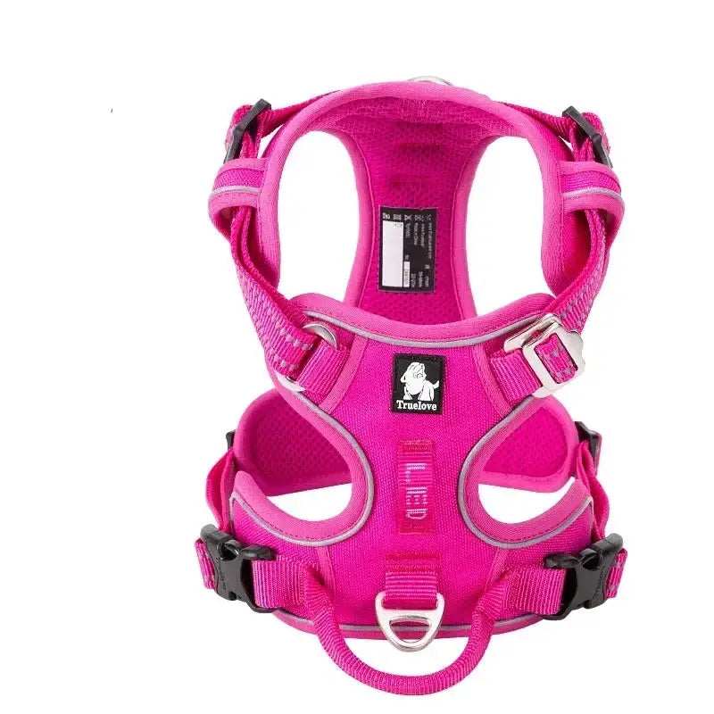 Bright pink dog harness with adjustable straps and metal buckles.