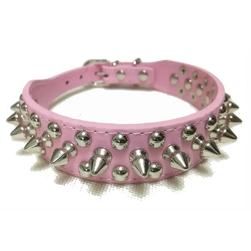 Pink leather dog collar adorned with metal spikes and studs.