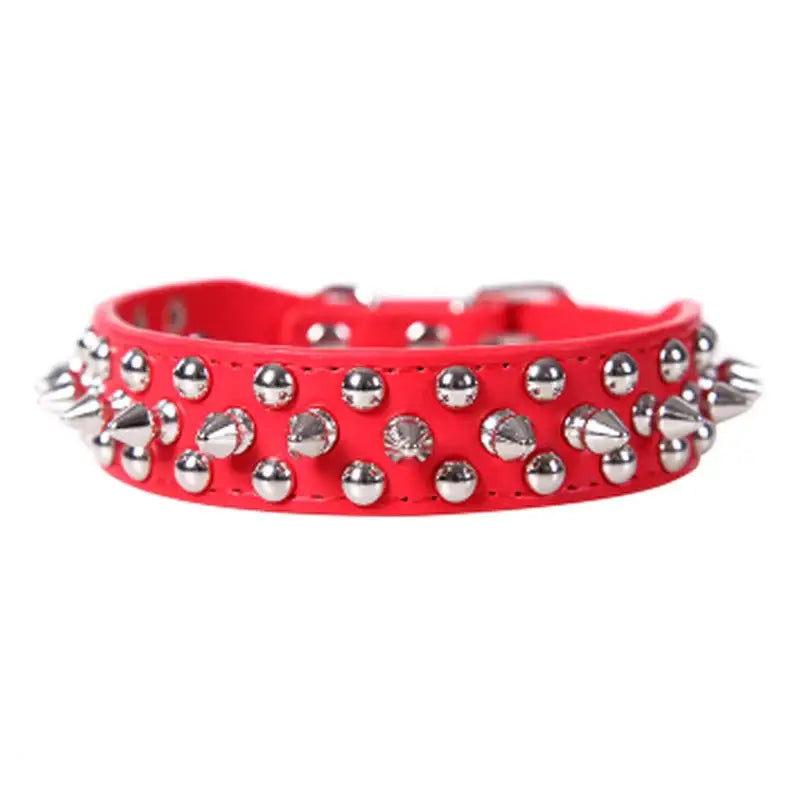 Red leather dog collar adorned with metal spikes and studs.