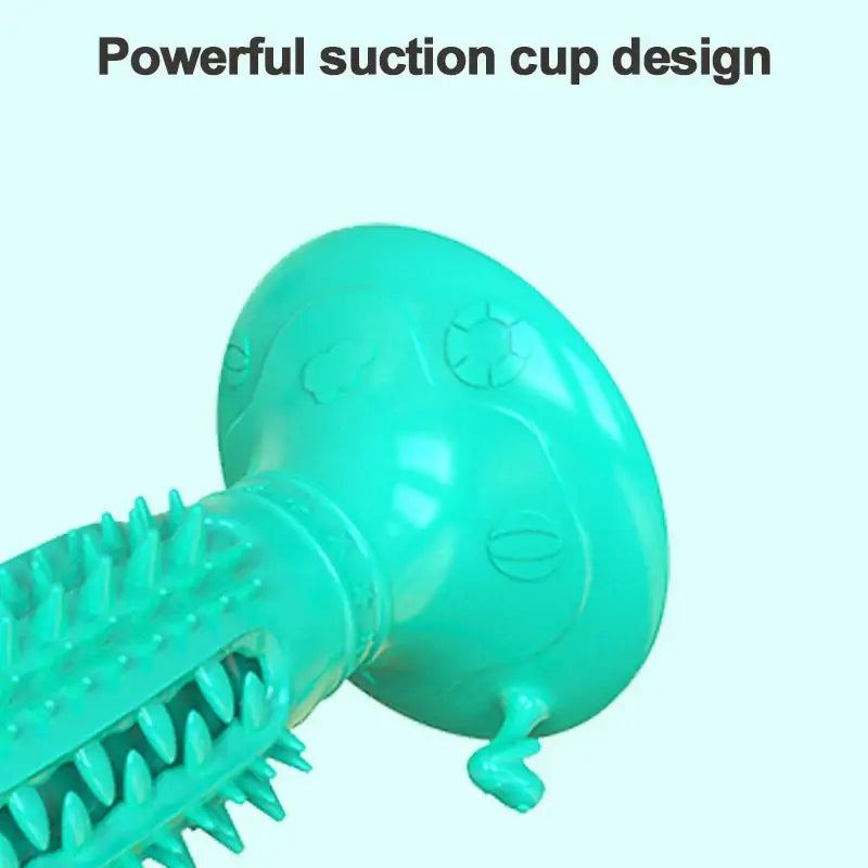 Teal-colored suction cup with an attached textured handle.