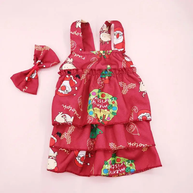 Red Christmas-themed toddler dress with matching hair bow.