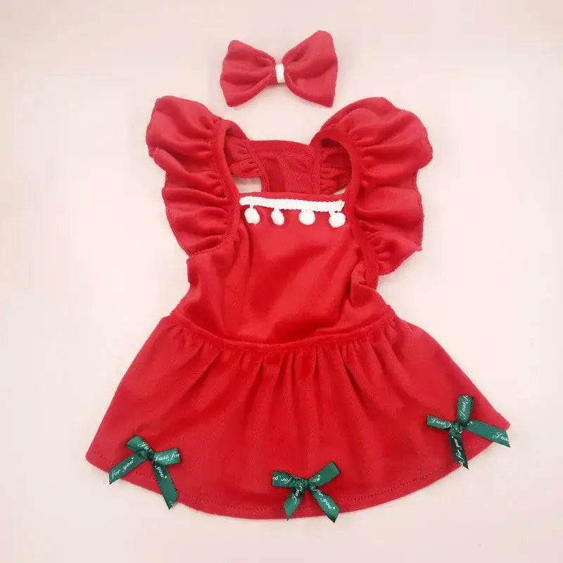 Red ruffled dress with green bows and a matching hair bow.