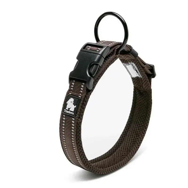 Brown padded dog collar with a plastic buckle and metal ring.