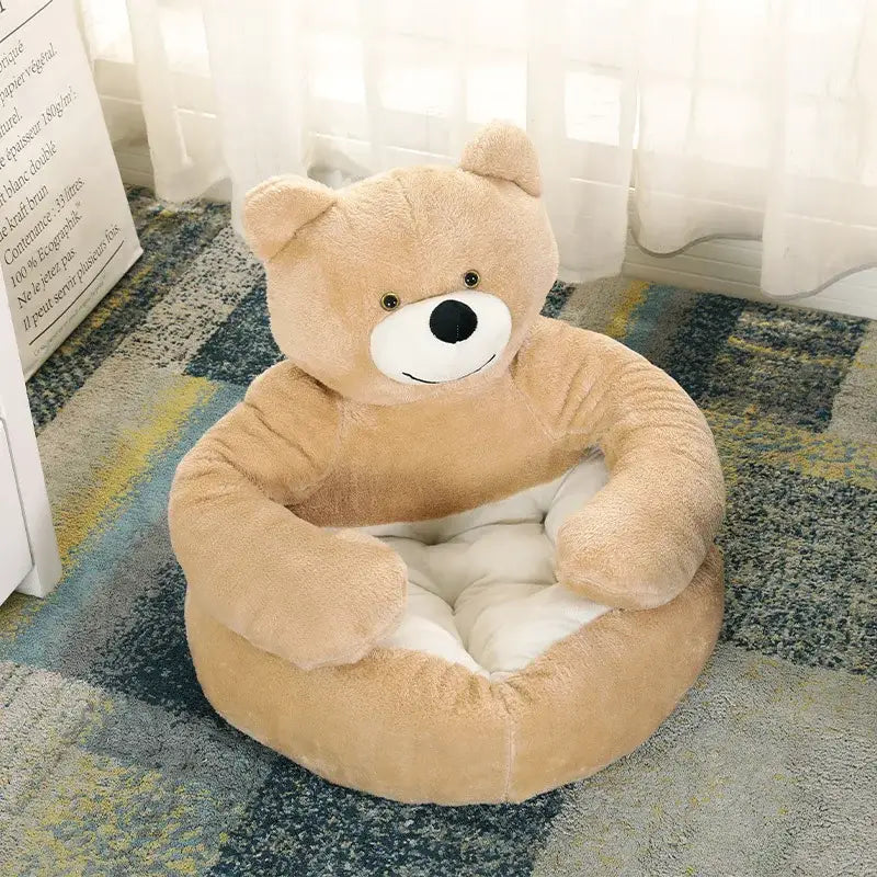 Plush teddy bear-shaped chair or seat cushion.