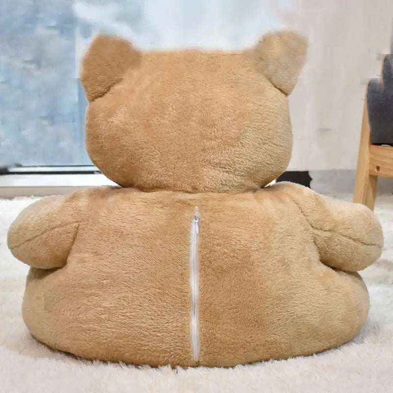 Plush teddy bear viewed from behind.