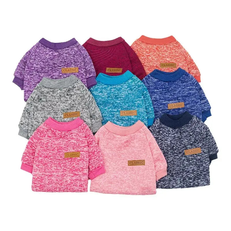 Collection of colorful, heathered sweaters or sweatshirts for pets with leather patch accents.