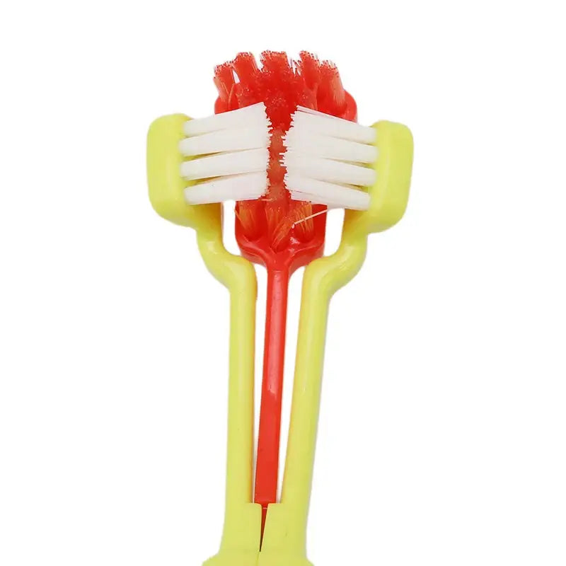 Plastic toothbrush with a red handle and yellow bristle holder.