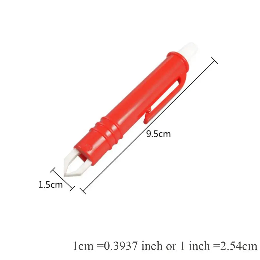 Red plastic pen-shaped tool with a metal tip, likely for removing staples or scoring.