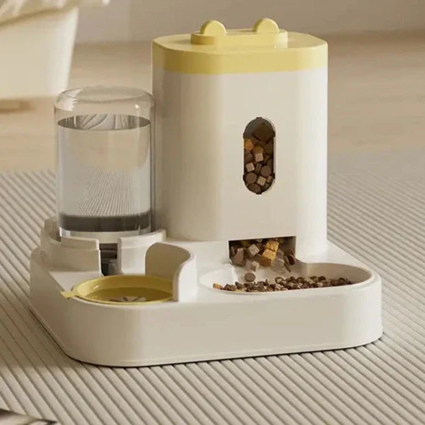 Pet feeder and water dispenser with a yellow lid and white base.