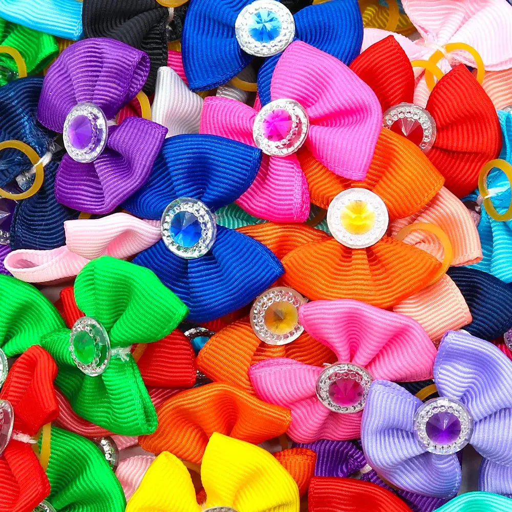 Colorful collection of fabric hair bows with jeweled centers.