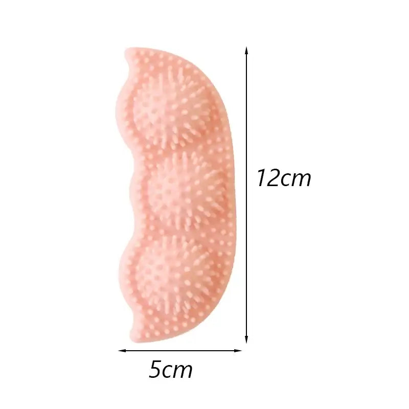 Pink, kidney-shaped object with a textured surface, measuring 12cm by 5cm.