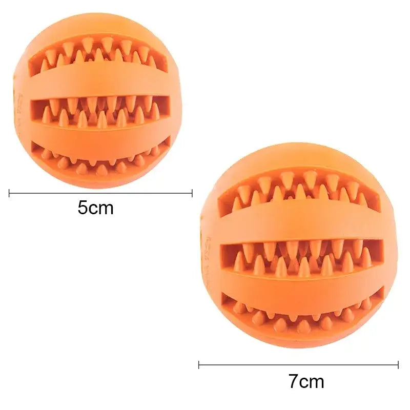 Orange rubber ball with ridged grooves designed for pet chewing or play.