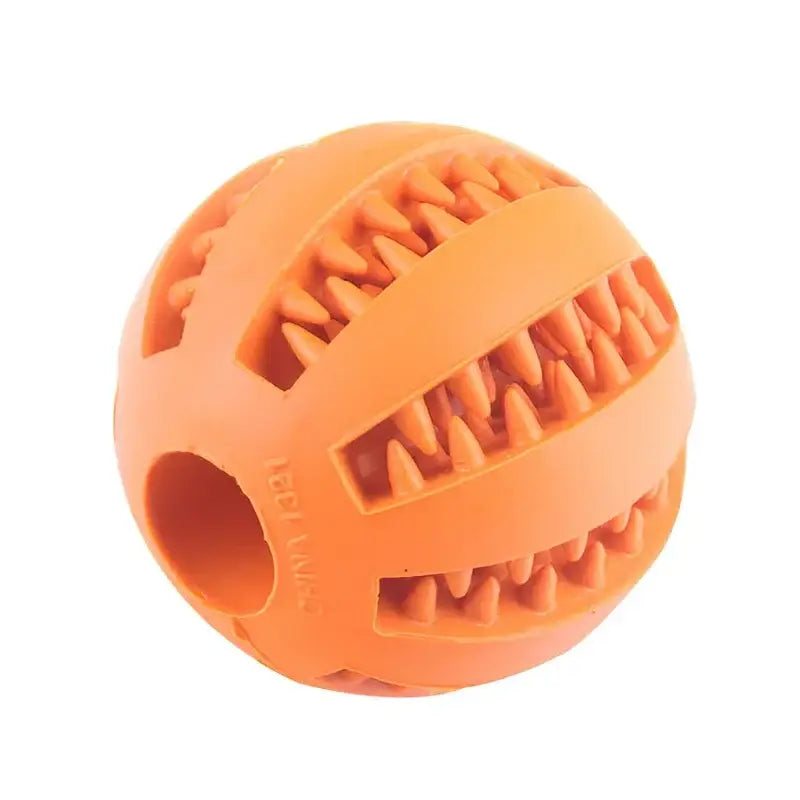 Orange rubber ball with grooved patterns designed as a dog chew toy.