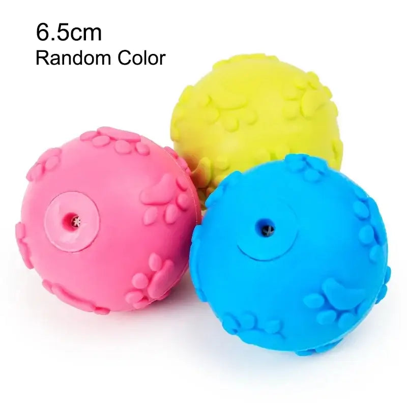 Colorful rubber dog toys with textured surfaces and squeakers.