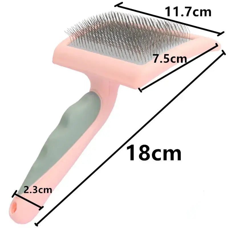 Pet grooming brush with metal bristles and a pink and green ergonomic handle.