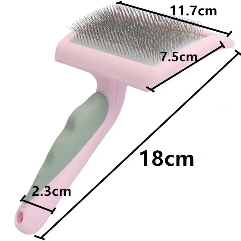 Pet grooming brush with a pink handle and metal bristles.