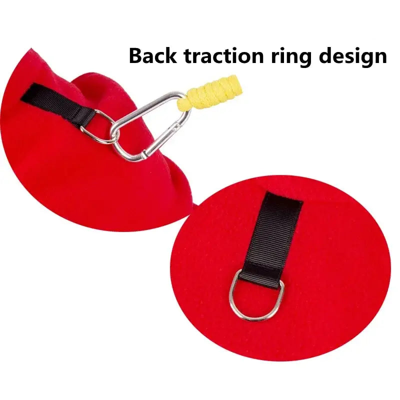 Red traction ring with a metal clip and adjustable strap for back support or exercise.