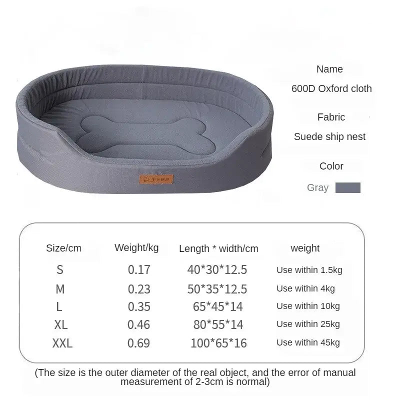 Gray oval dog bed with a bone-shaped cushion and a small label.