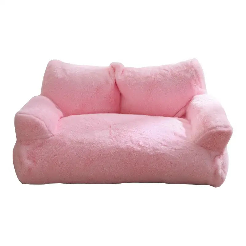 Pink plush sofa with soft, rounded contours.