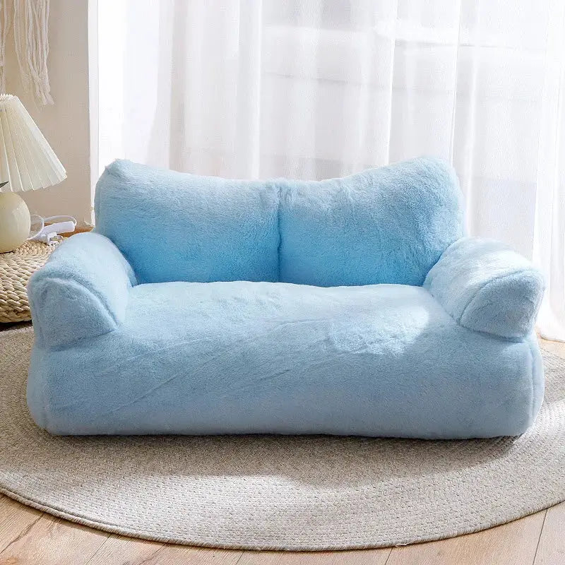 Plush light blue loveseat with soft, rounded contours.