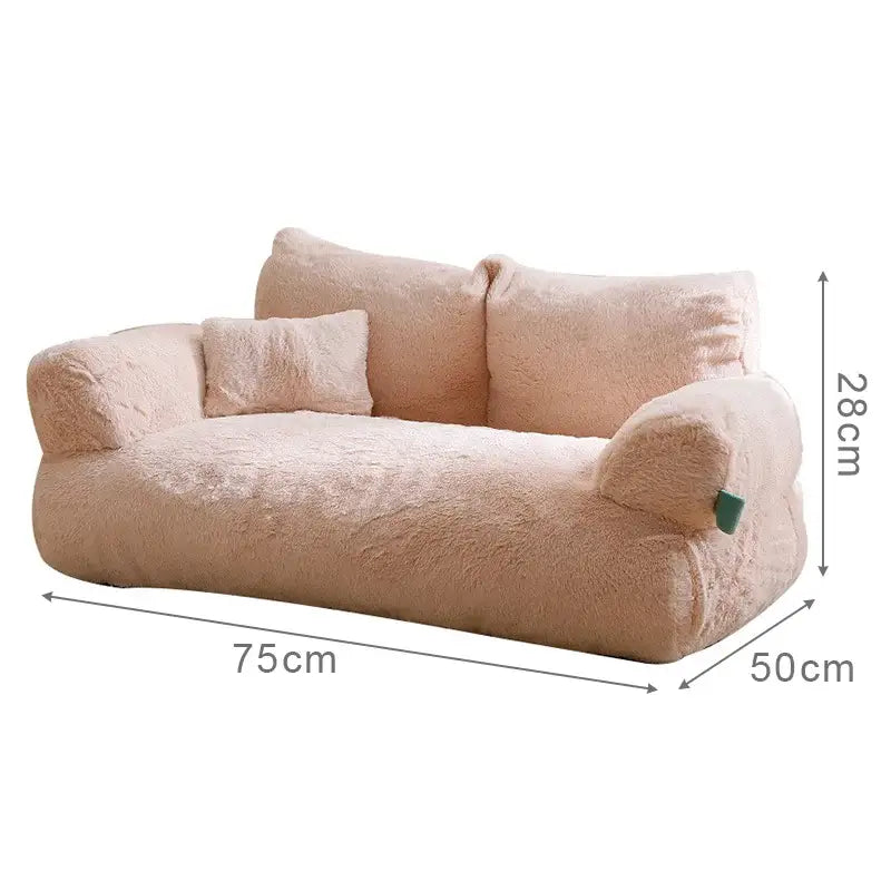 Plush, miniature sofa in a soft pink color with dimensions labeled.