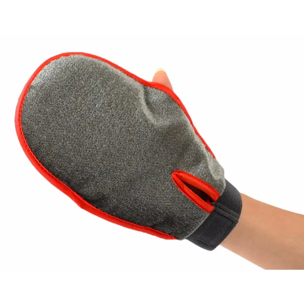 Grooming mitt or glove with a gray fabric surface and red trim.