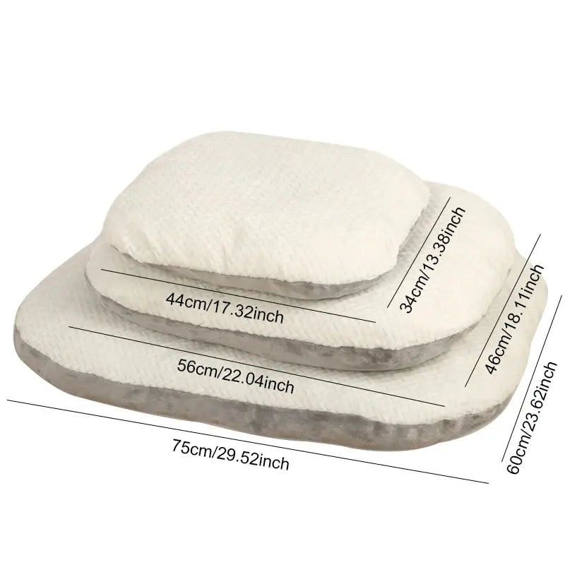 Set of oval-shaped pet beds or cushions in varying sizes.