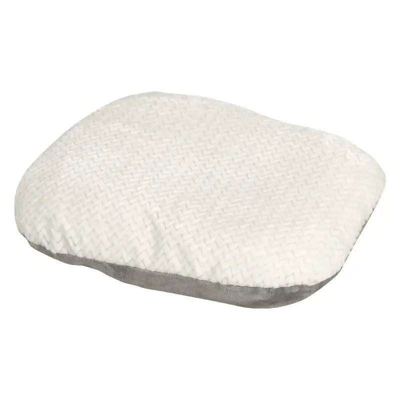 Soft, white cushion or pillow with a plush, textured surface.