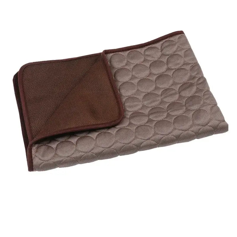 Quilted pet blanket or mat with a brown border and gray center featuring a circular pattern.