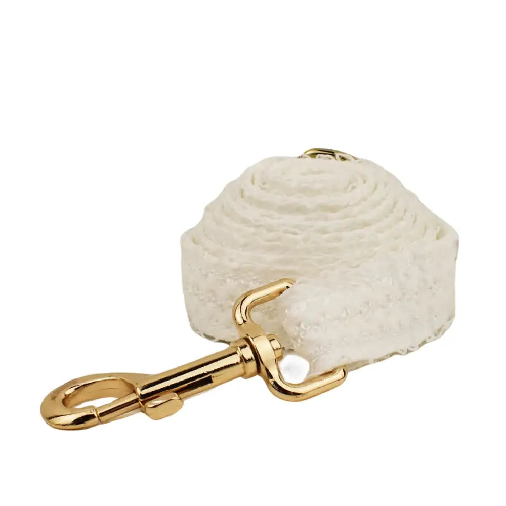 White fabric leash with a gold-colored metal clasp.