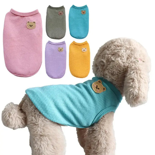 Dog sweater or vest in various pastel colors with small bear face embellishments.