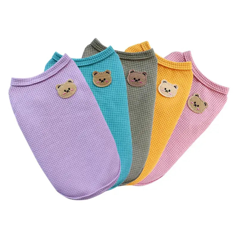 Set of colorful ankle socks with cute bear face designs.