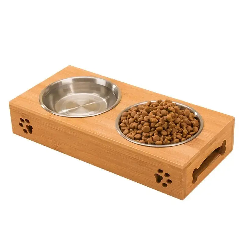 Pet feeding station with two bowls in a wooden base decorated with paw prints.