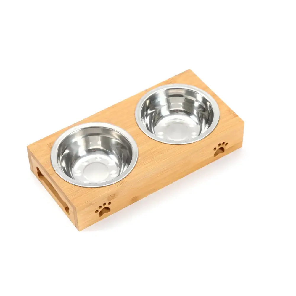 Wooden pet food bowl stand with two stainless steel dishes and paw print decorations.