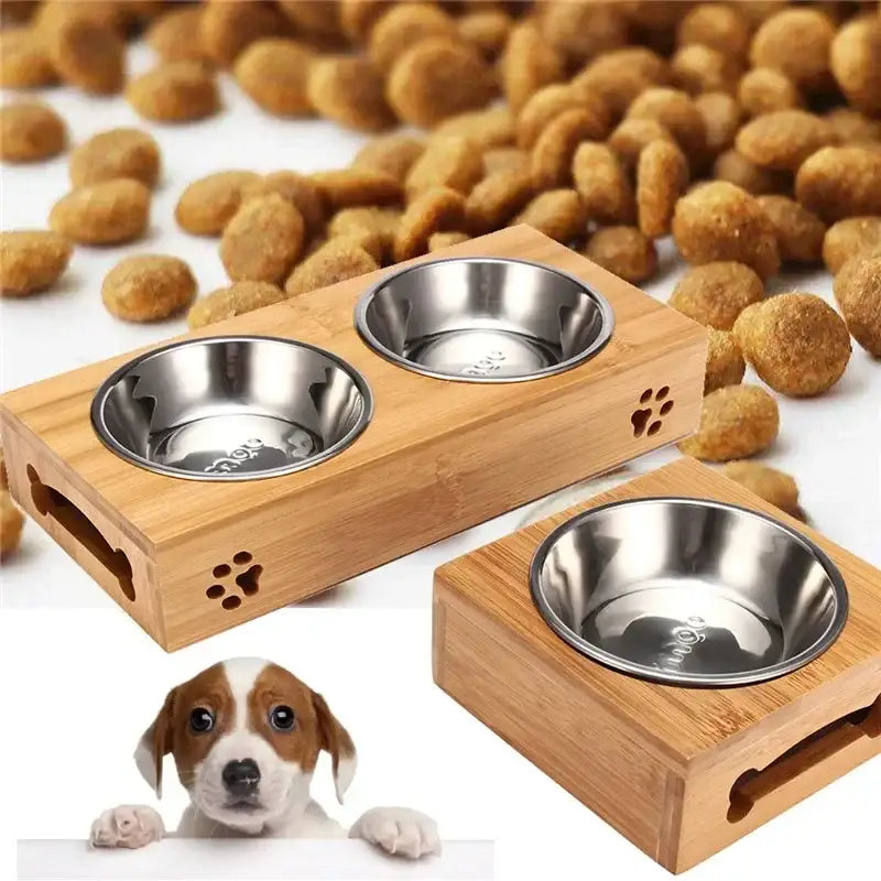 Wooden pet feeding station with stainless steel bowls and paw print decorations.