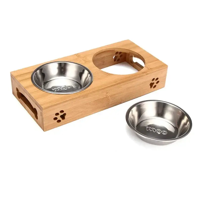 Wooden pet feeding station with two stainless steel bowls and paw print cutouts.