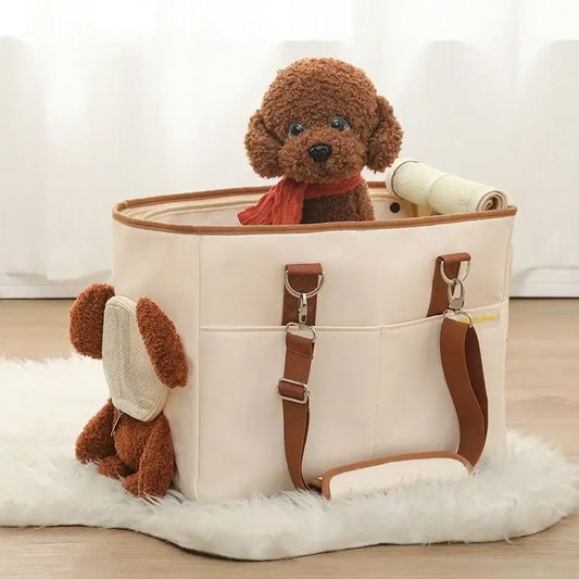 Plush toy dog peeking out of a cream-colored handbag with brown leather straps.