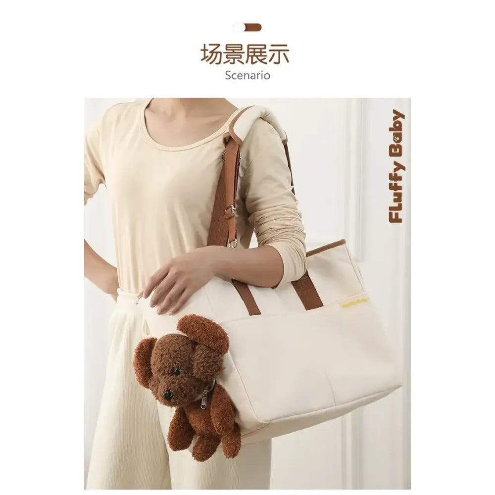 White tote bag with a brown teddy bear peeking out.