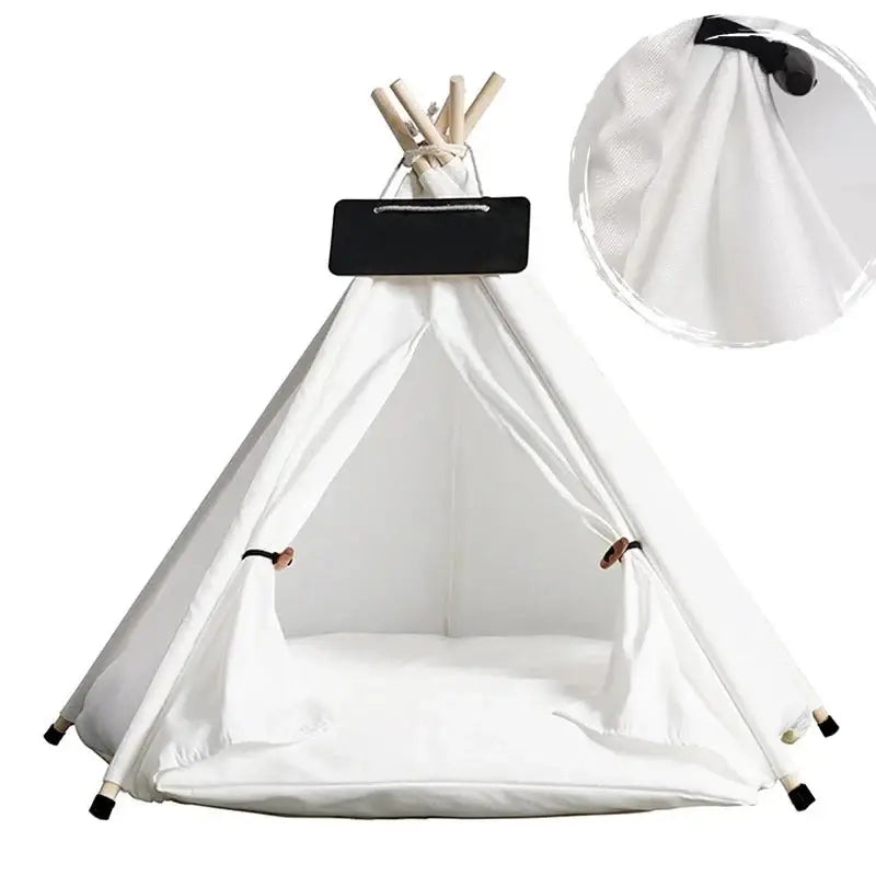 White teepee-style pet tent with a black nameplate on top.